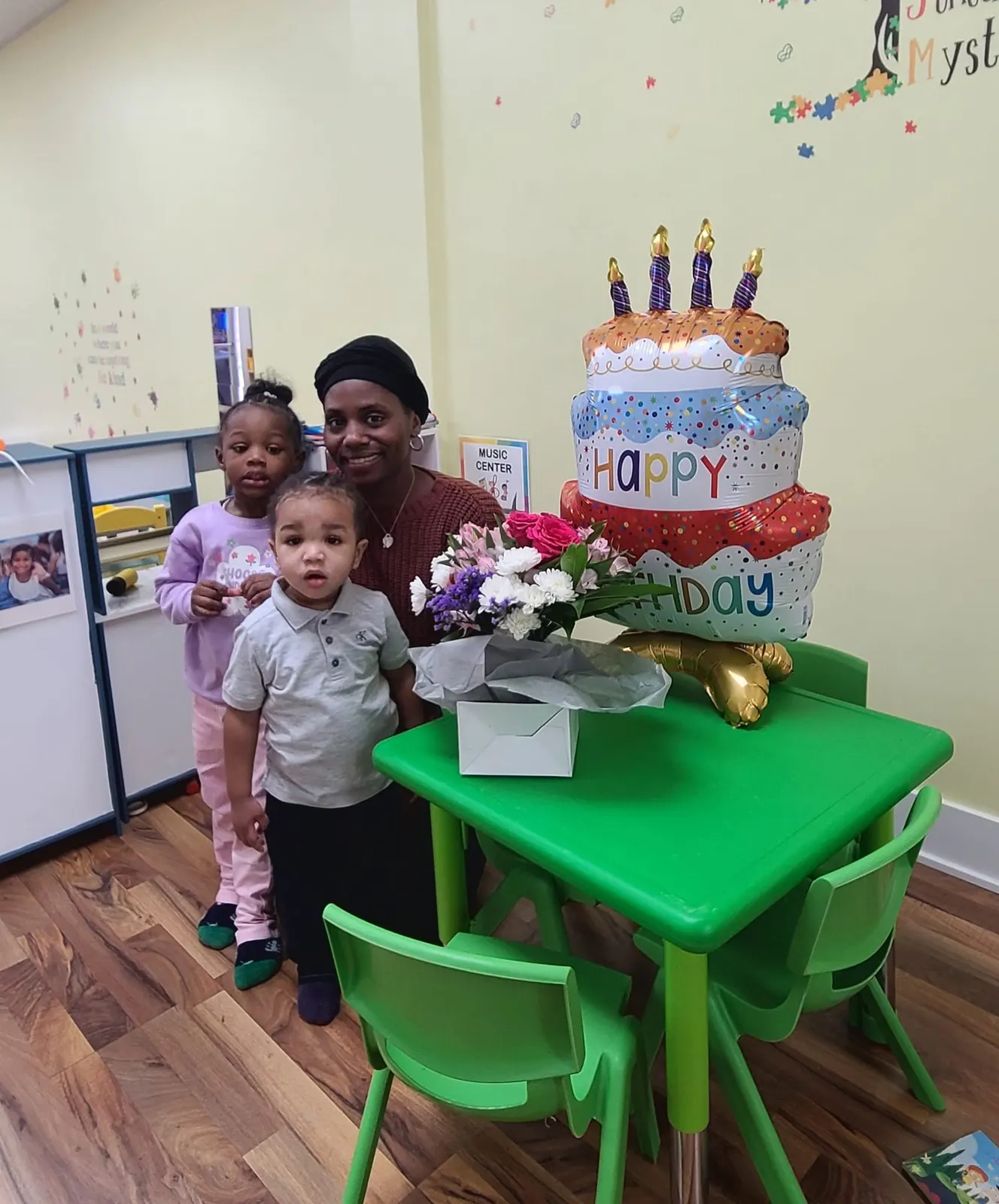 Birthday celebration with a cake at the classroom table