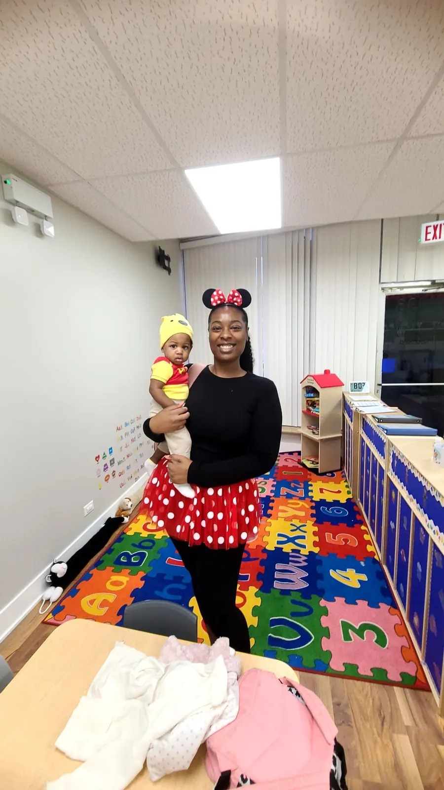 Staff member and child dressed up for a themed day