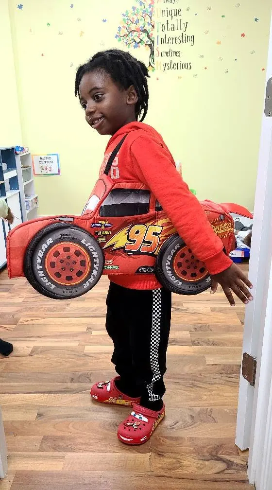 Child dressed as a race car for costume day